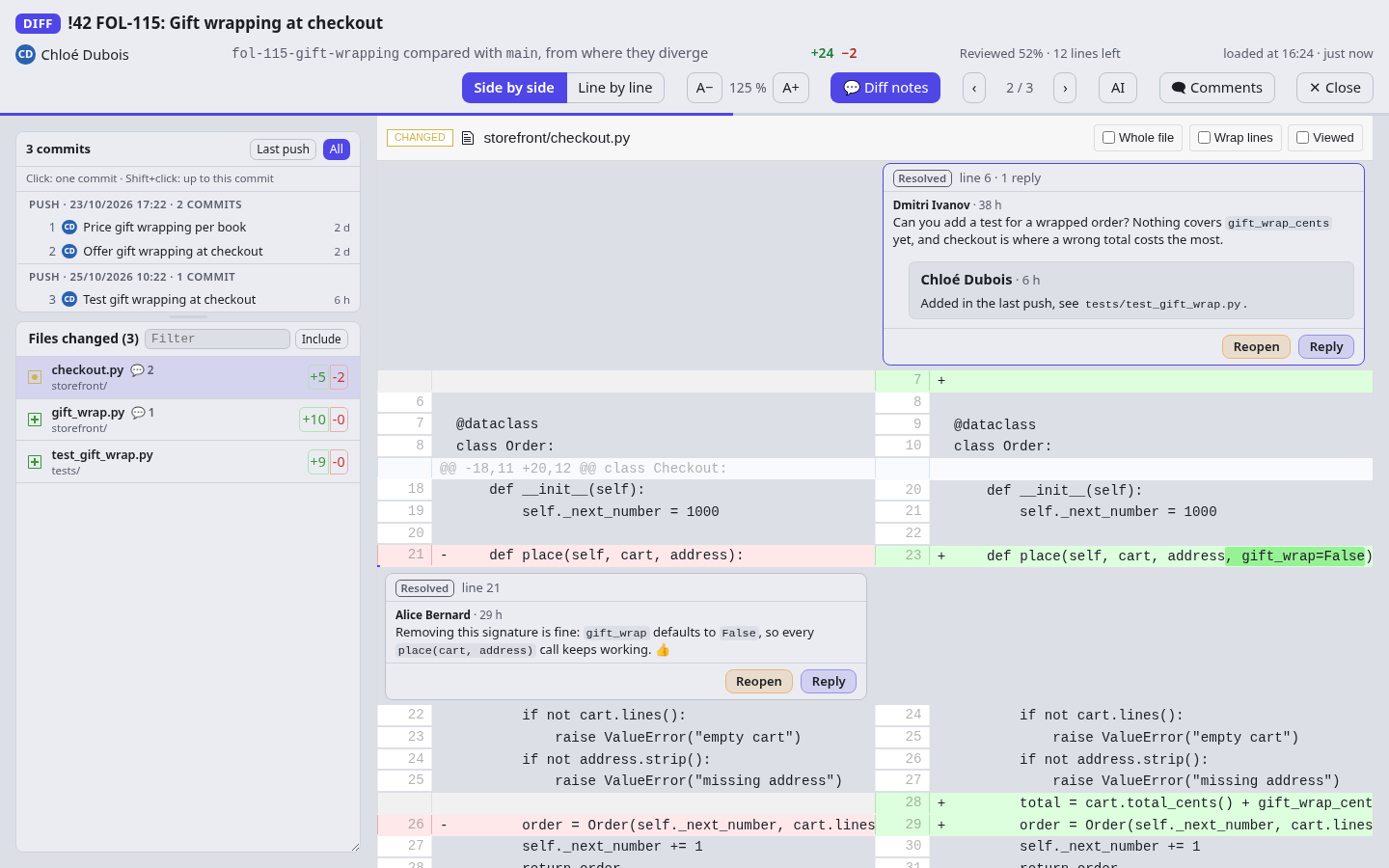 Review threads shown on their lines in the diff, one on a removed line, with Reply and Reopen buttons.